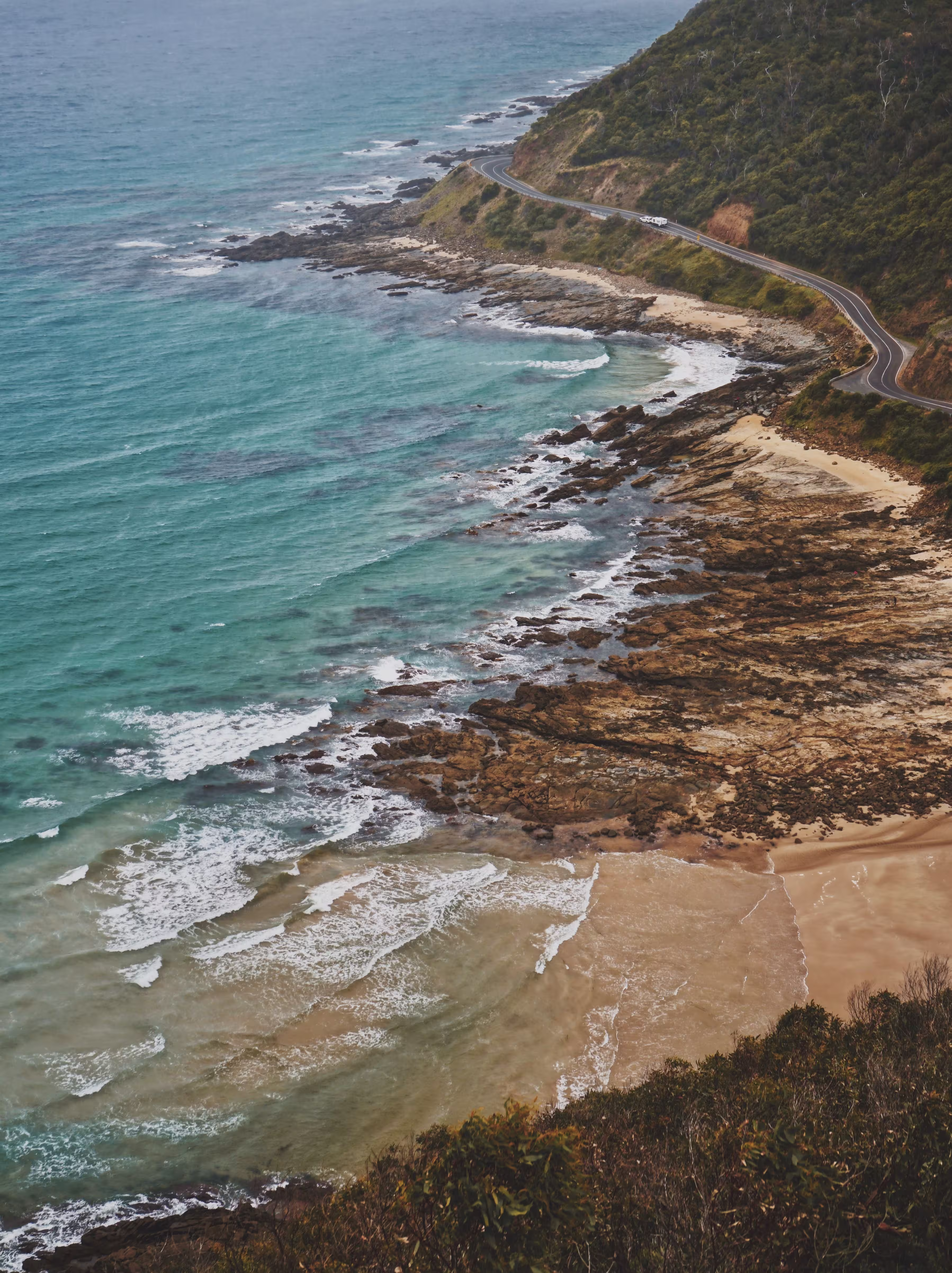 aerial-view-of-coastline-and-seaside-road