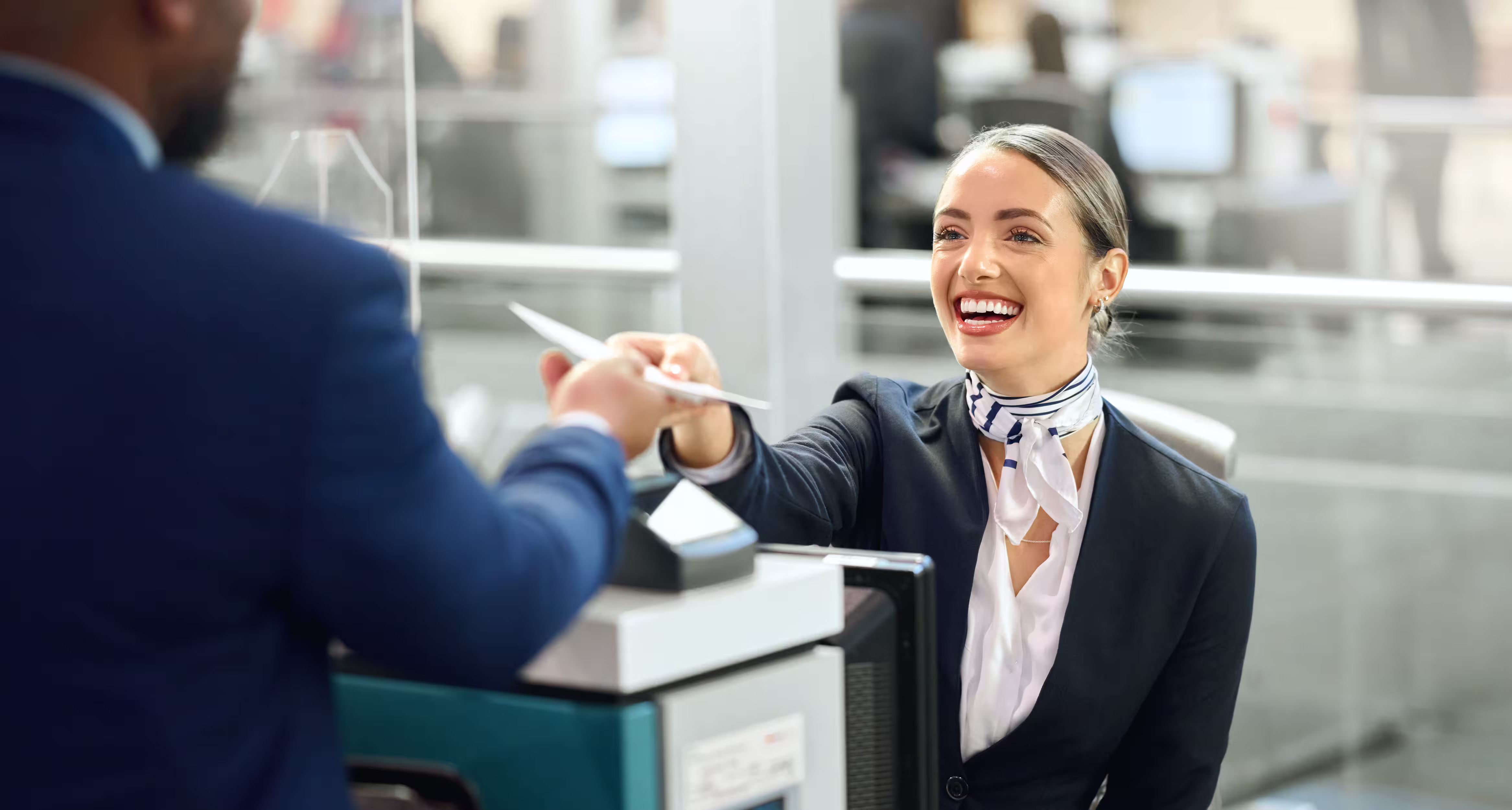 Passenger with passport at the airport check-in counter