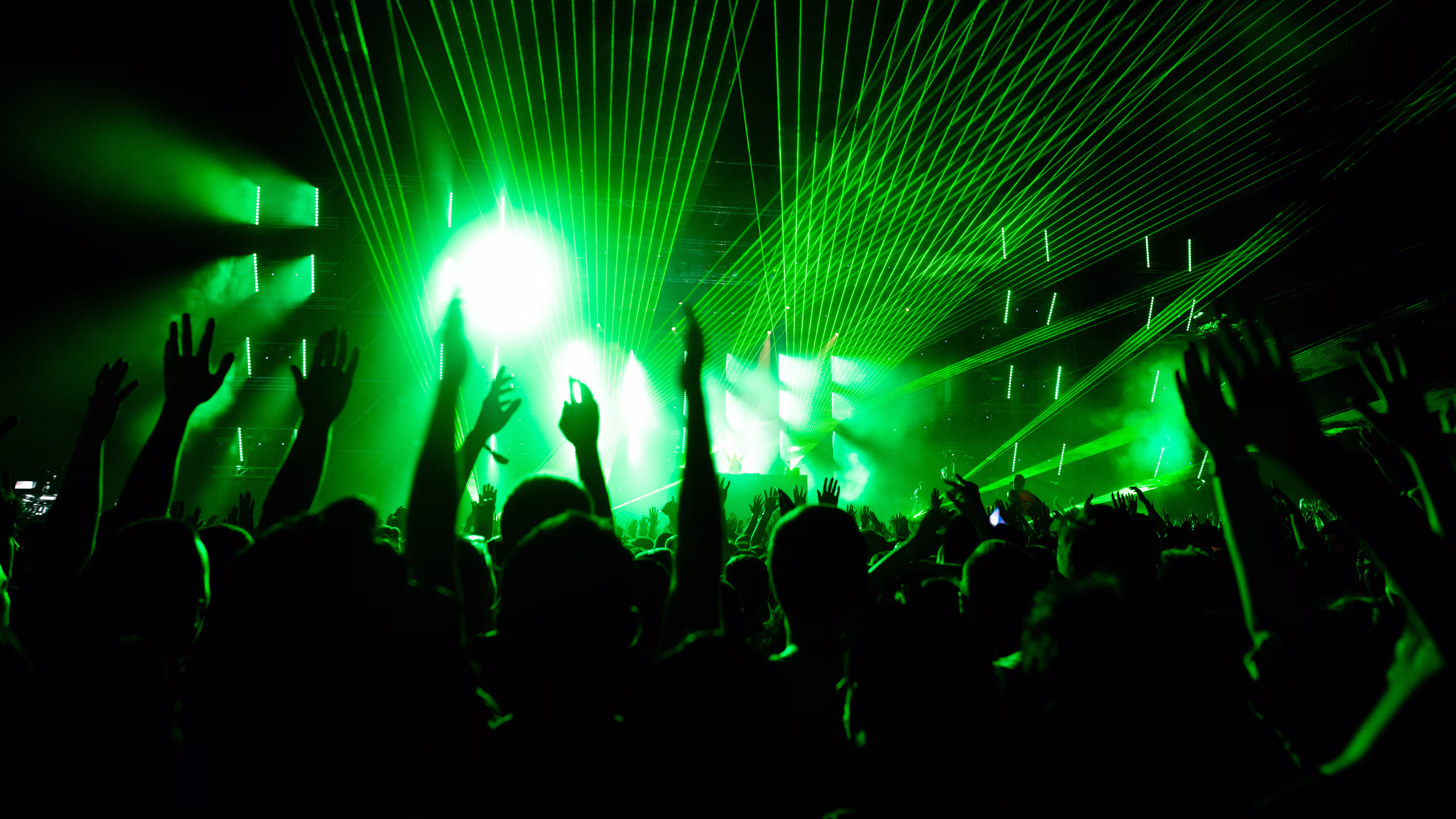 back-view-audience-with-arms-raised-front-stage-mu