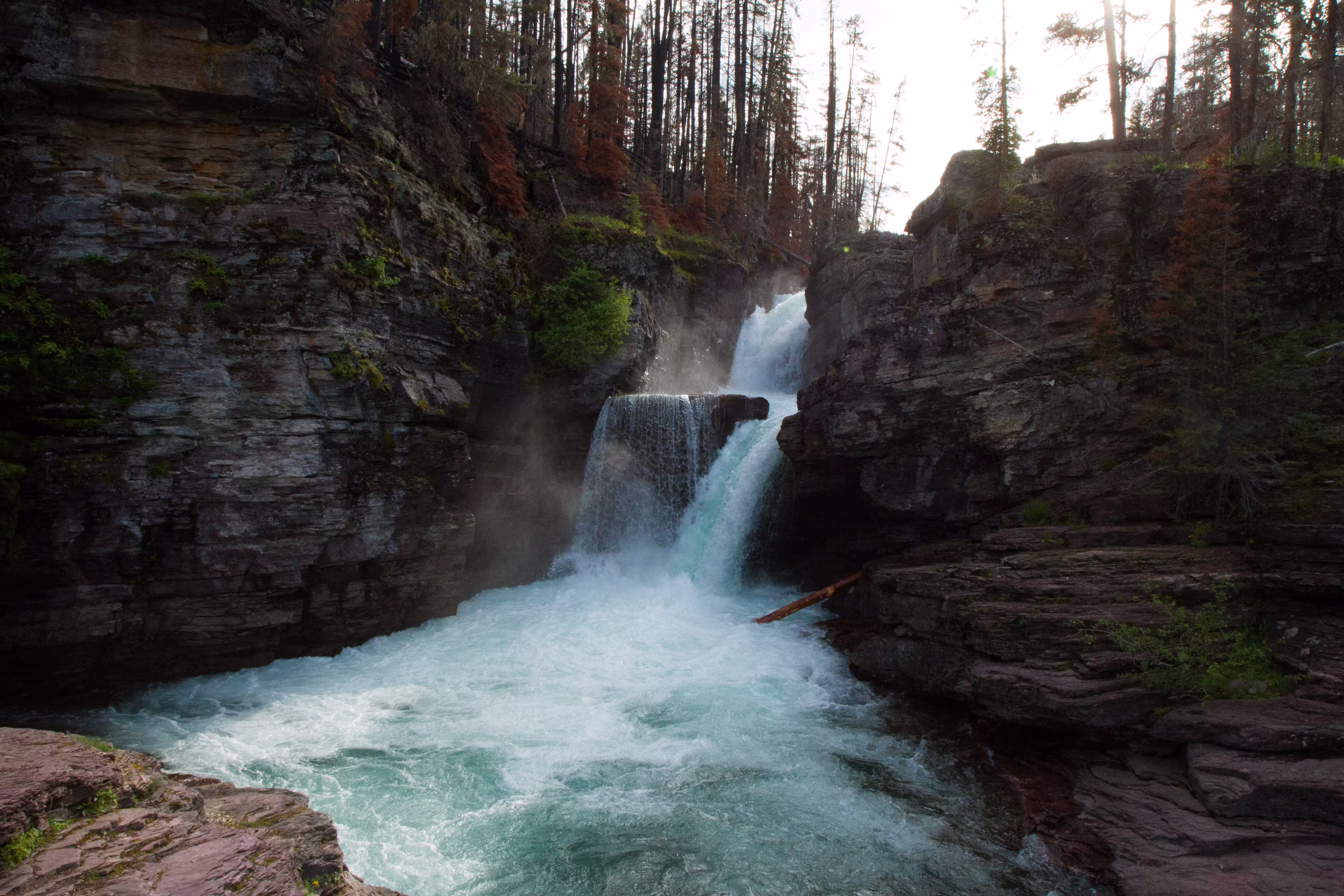 beautiful-shot-waterfall-middle-cliff-surrounded
