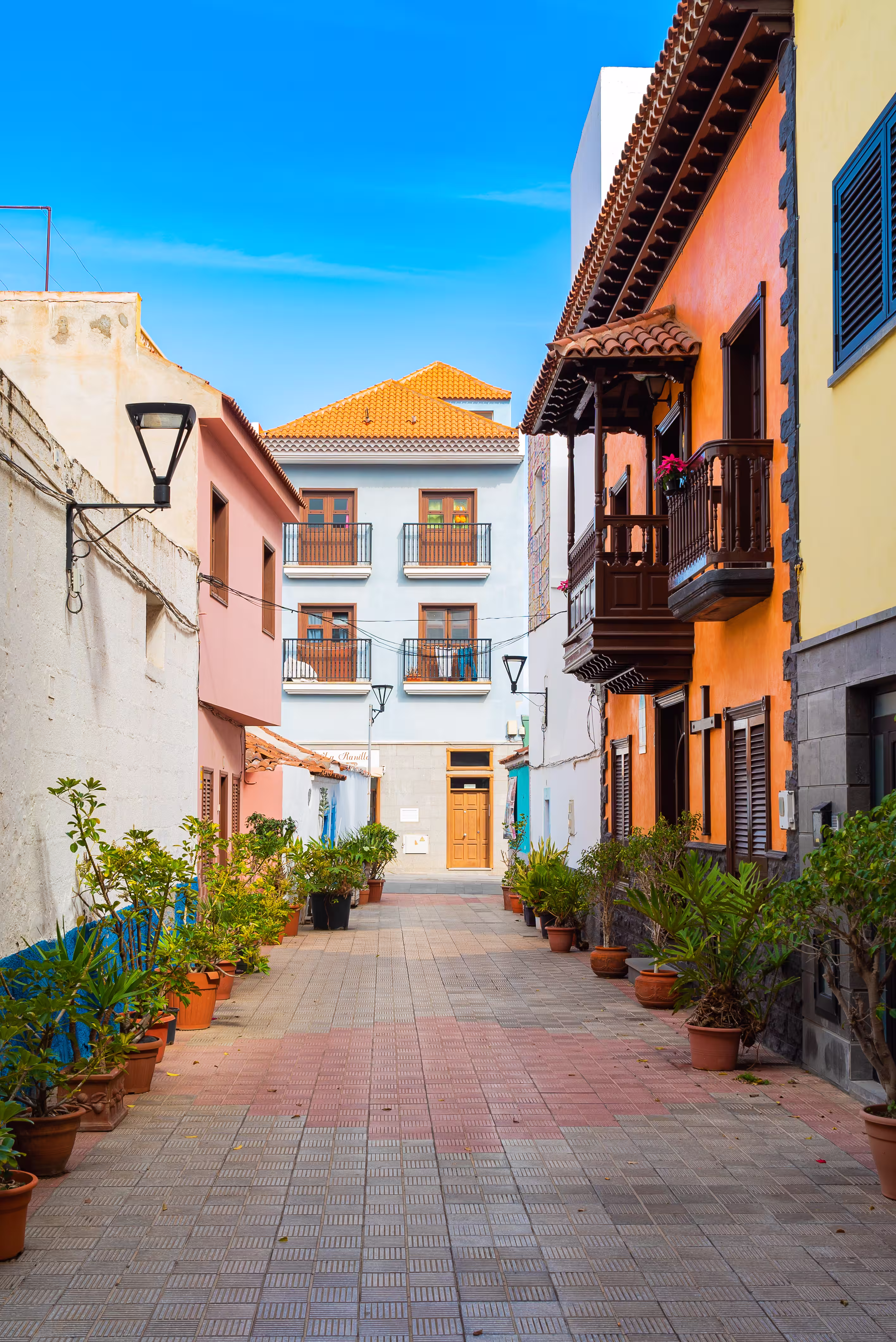 Colorful buildings along a narrow street in a tropical island town