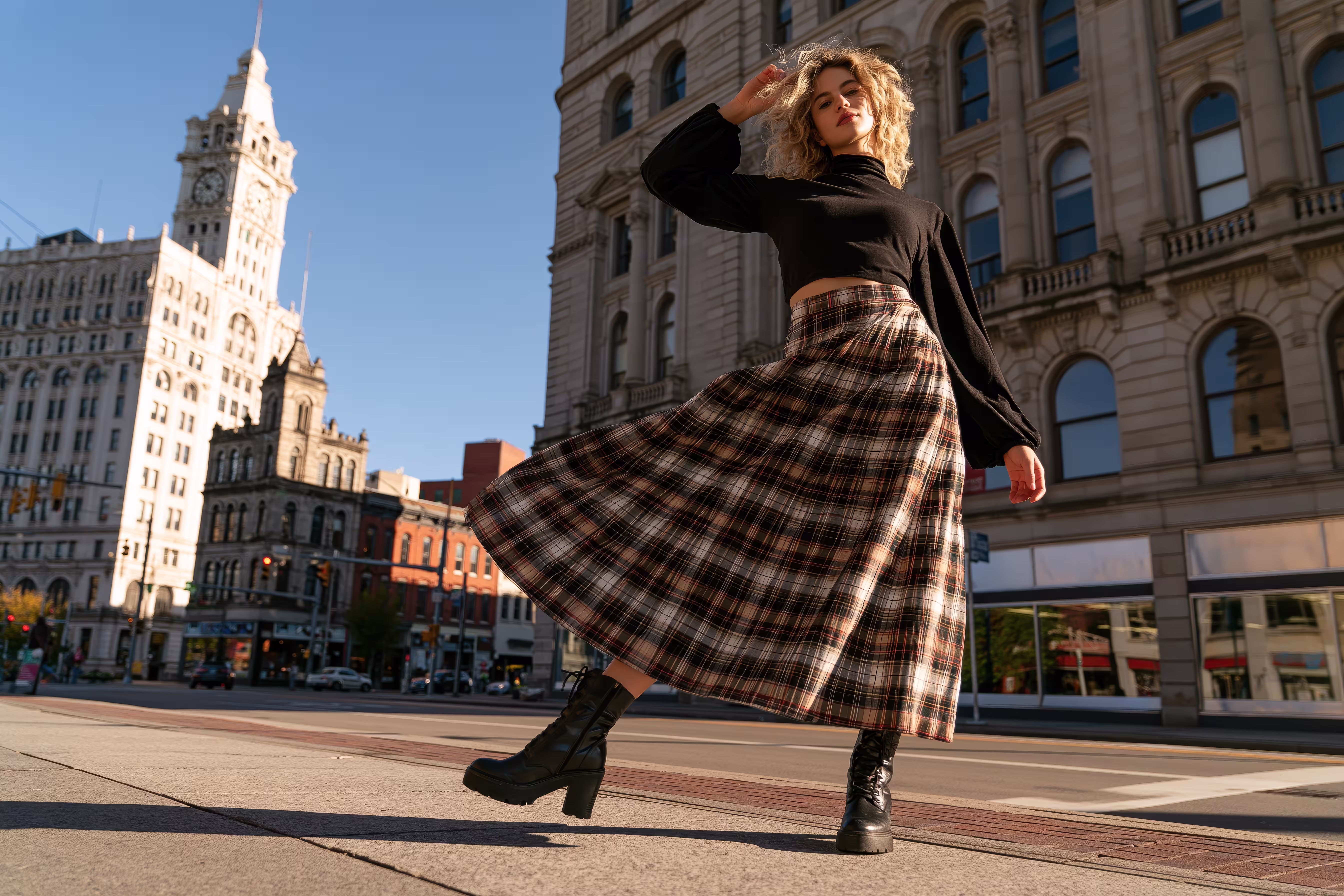 fashionable-woman-posing-plaid-skirt-boots-city