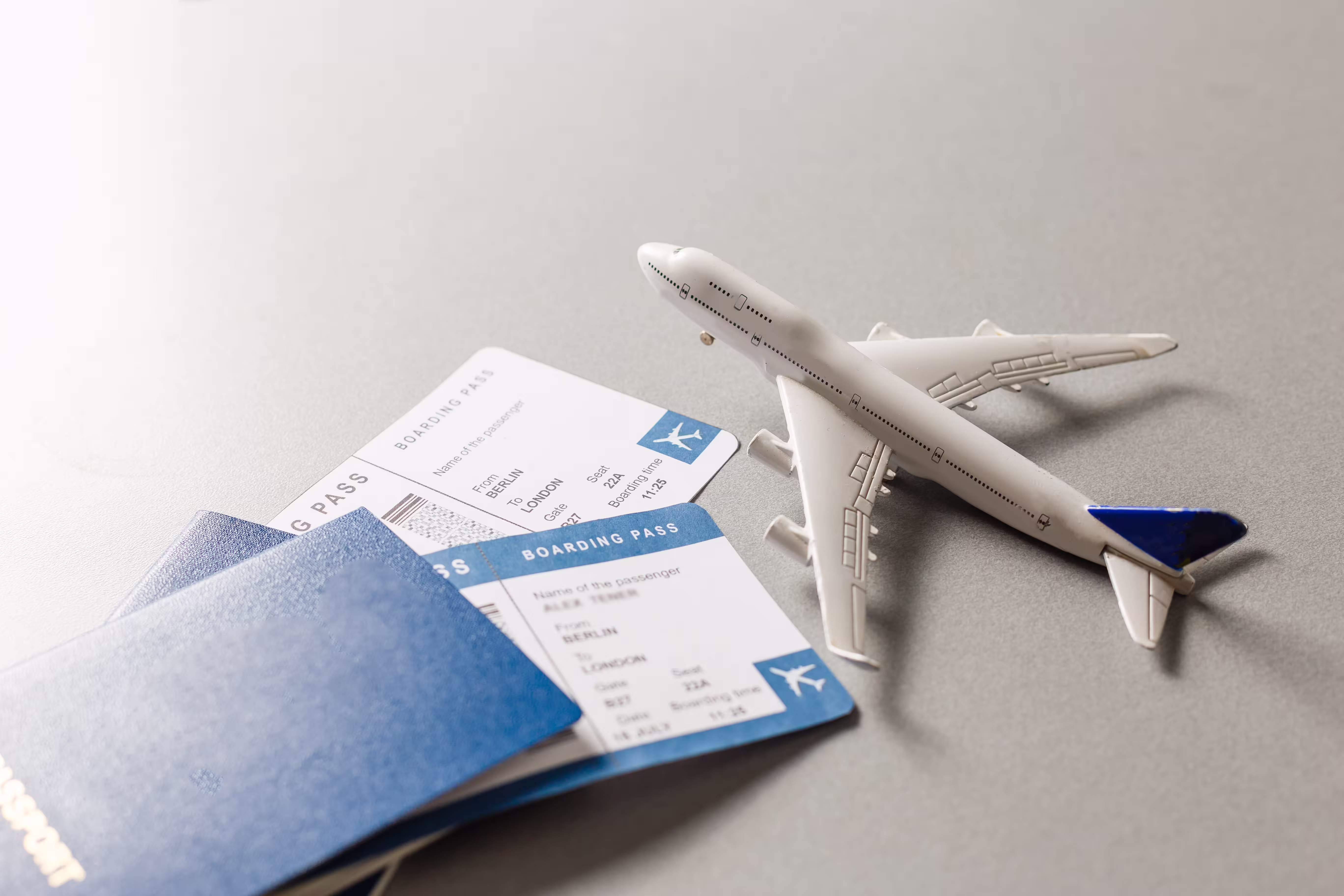 Flight tickets with passports and a model airplane