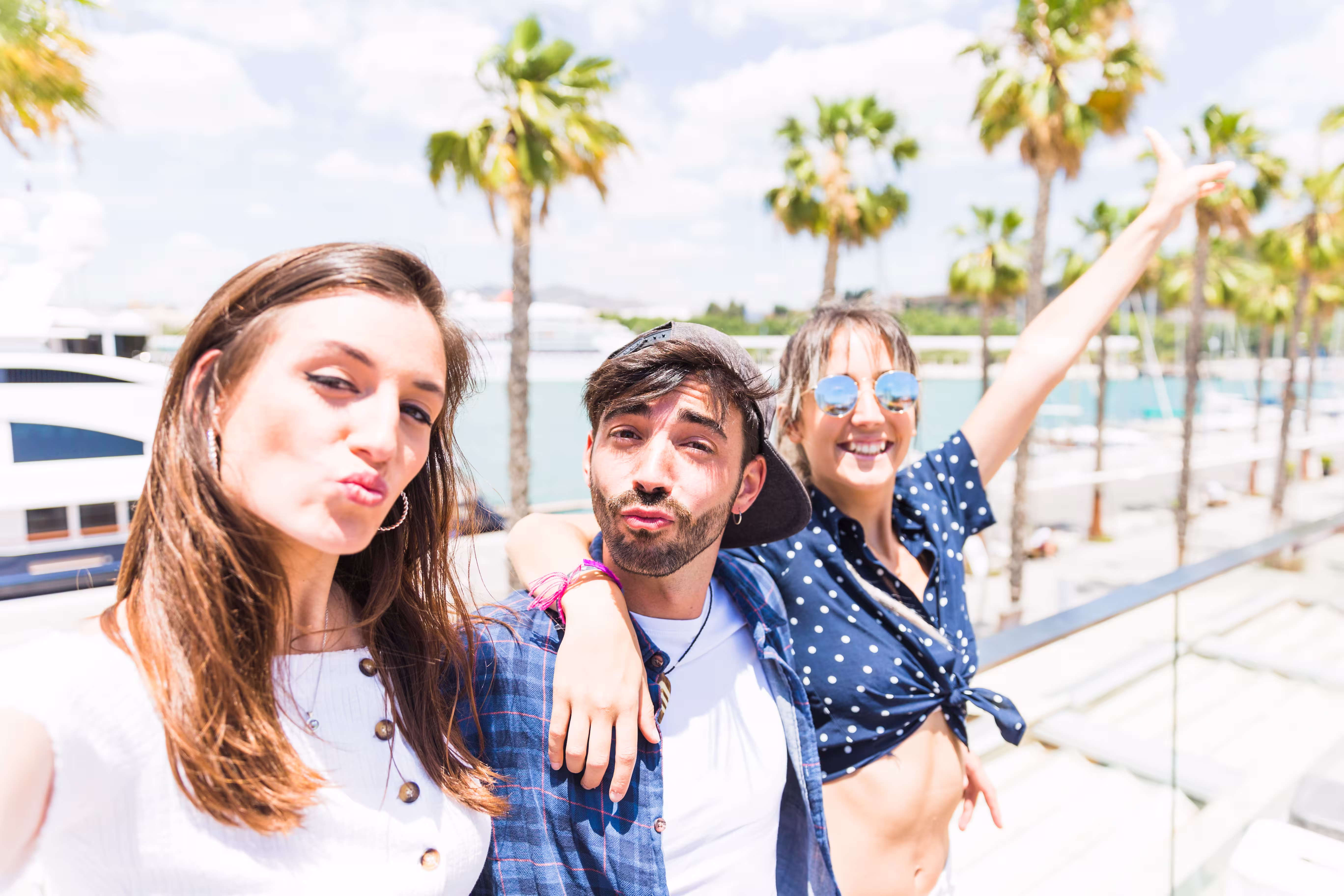 happy-friends-sending-air-kiss-camera