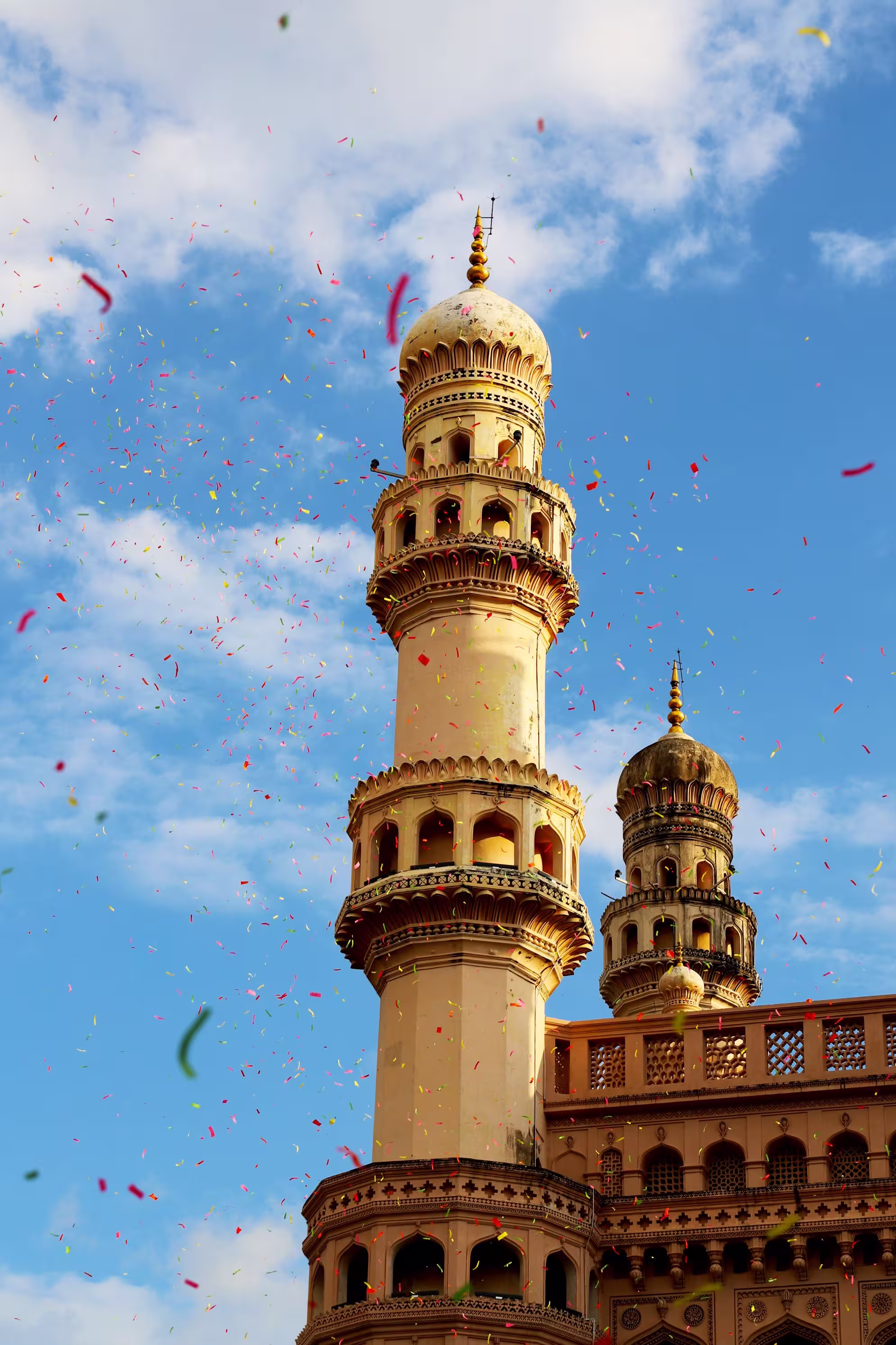 Charminar in Hyderabad against a sunny blue sky