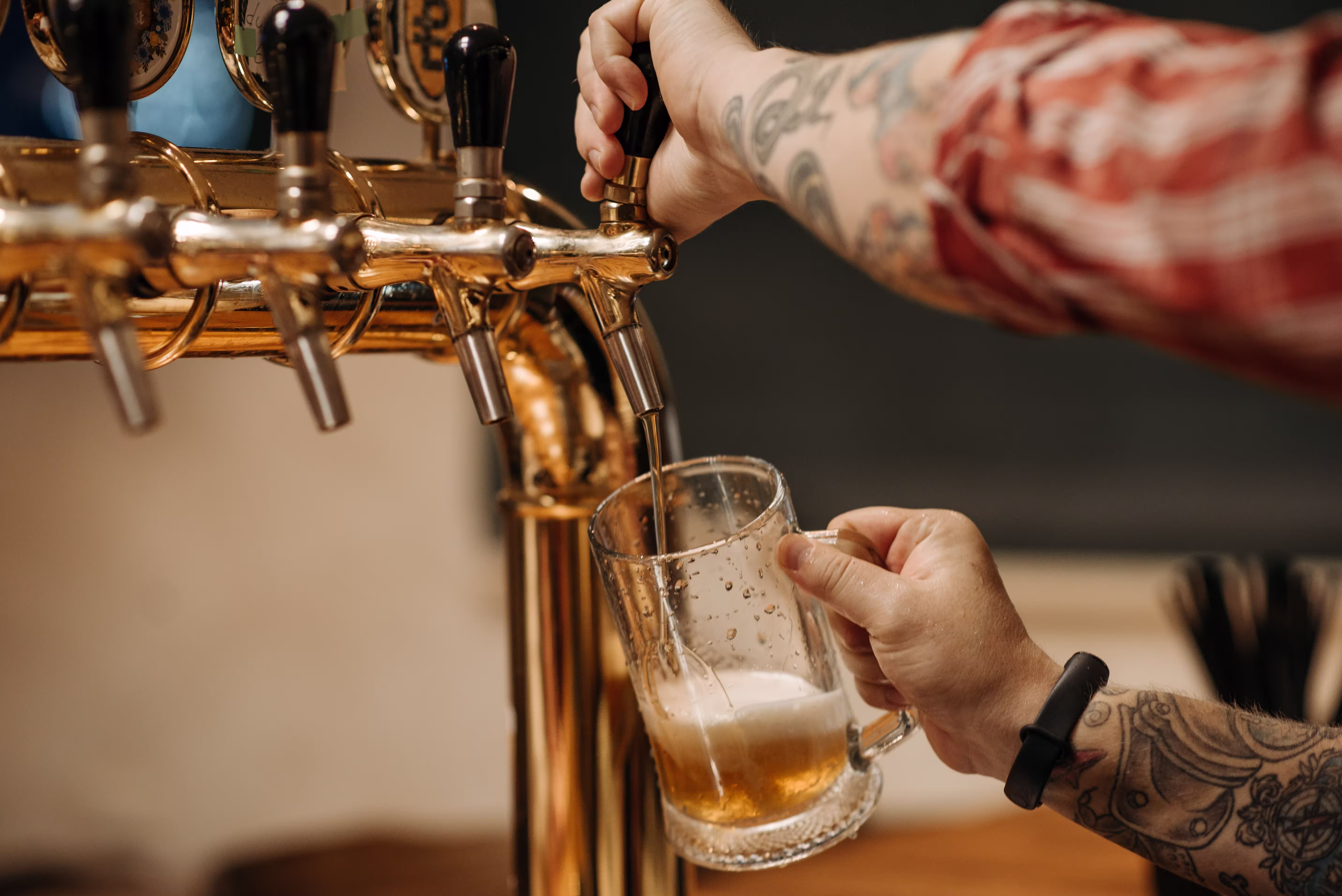 Man pouring beer in glass