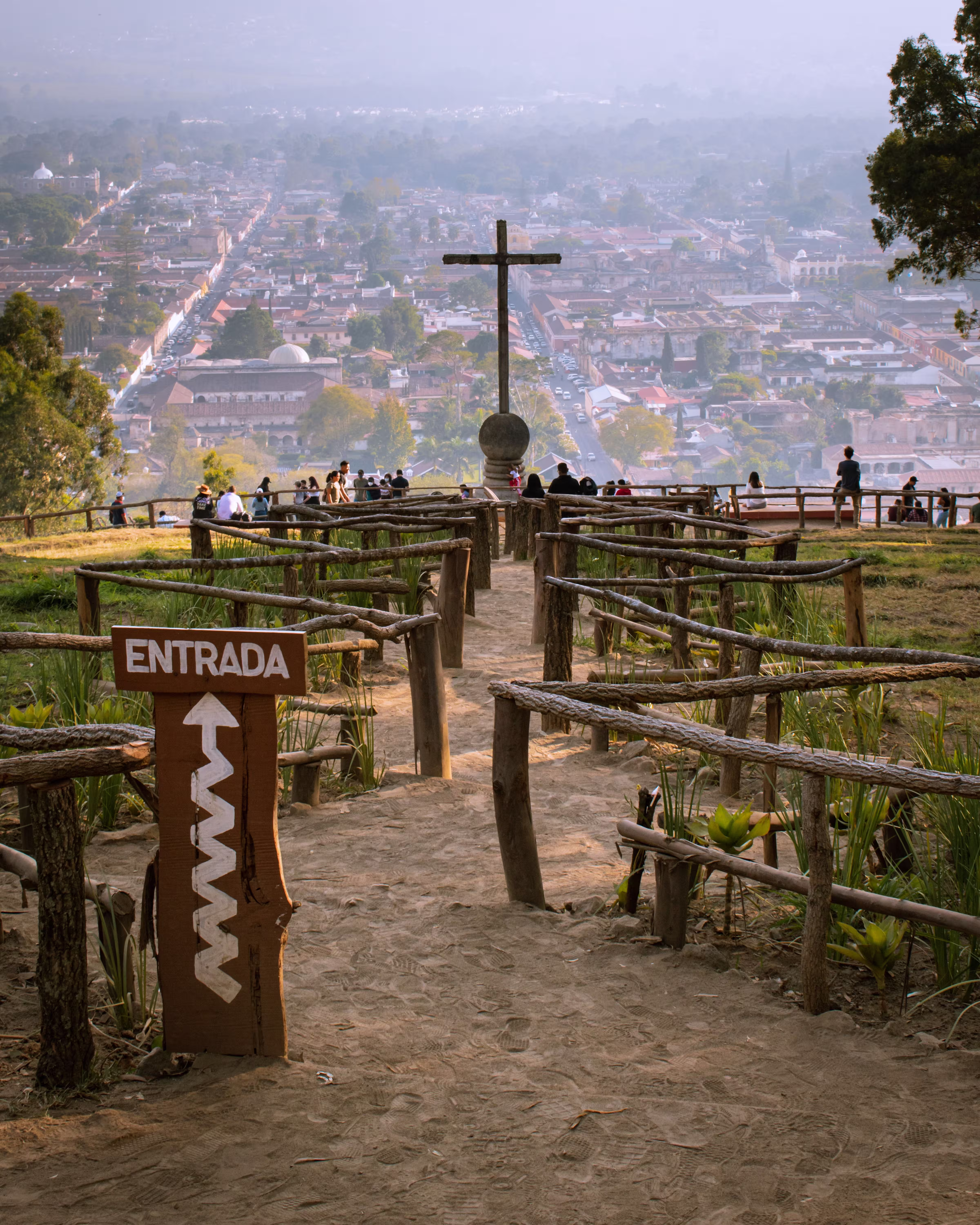 Pathway towards a cross on a hilltop