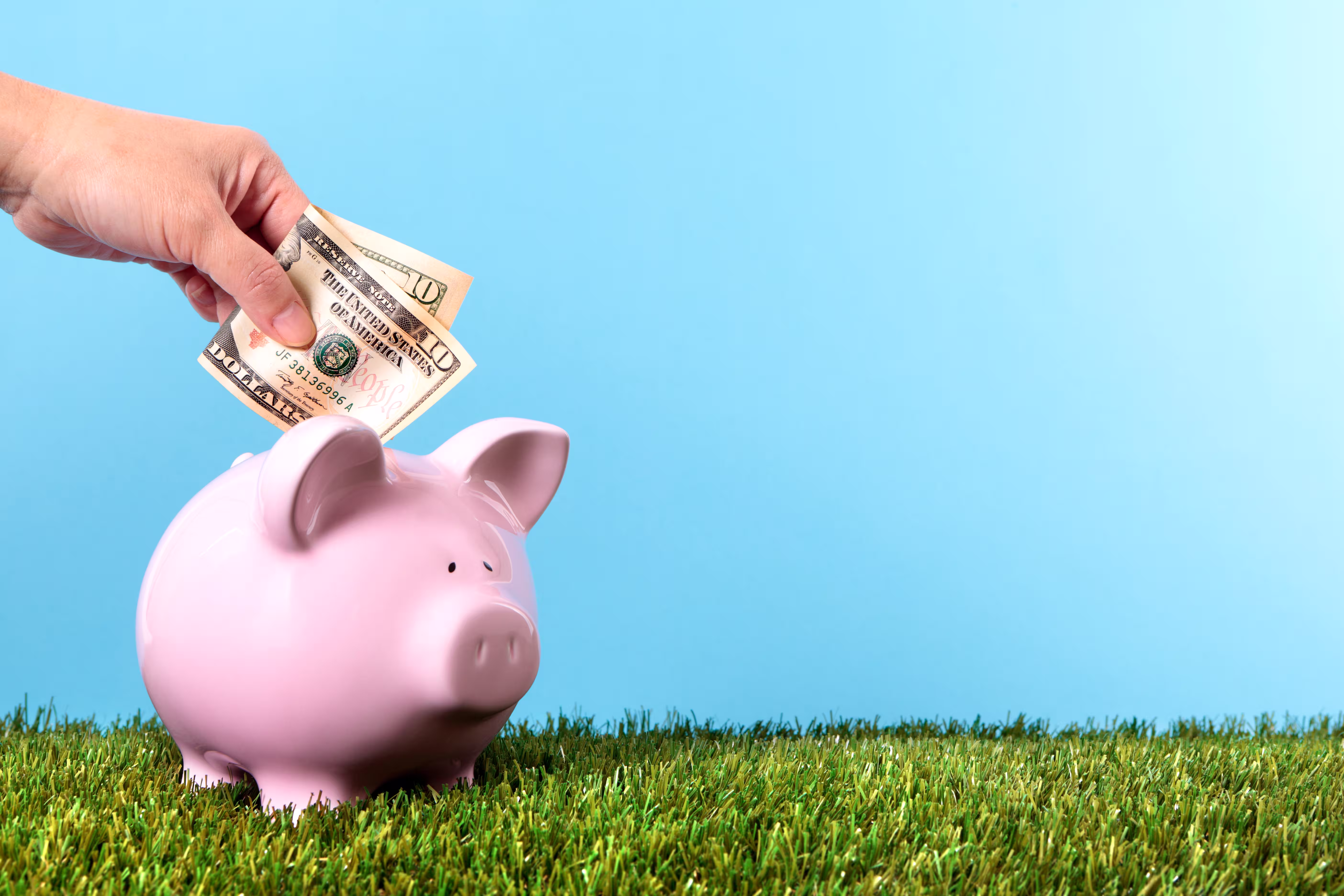 Piggy bank savings representing redeeming Triwize Coins on a flight booking