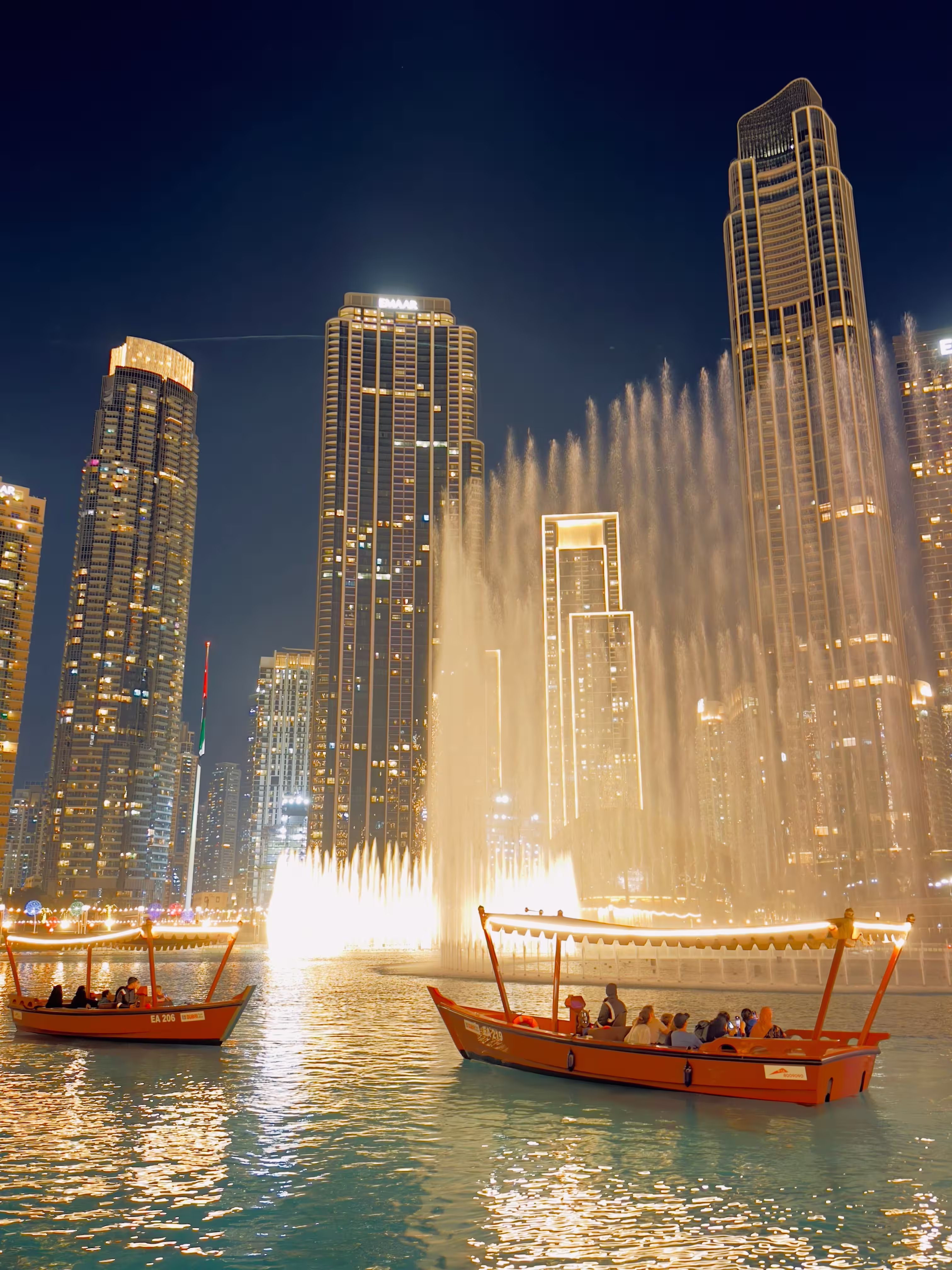 Dubai fountain and skyscraper at night