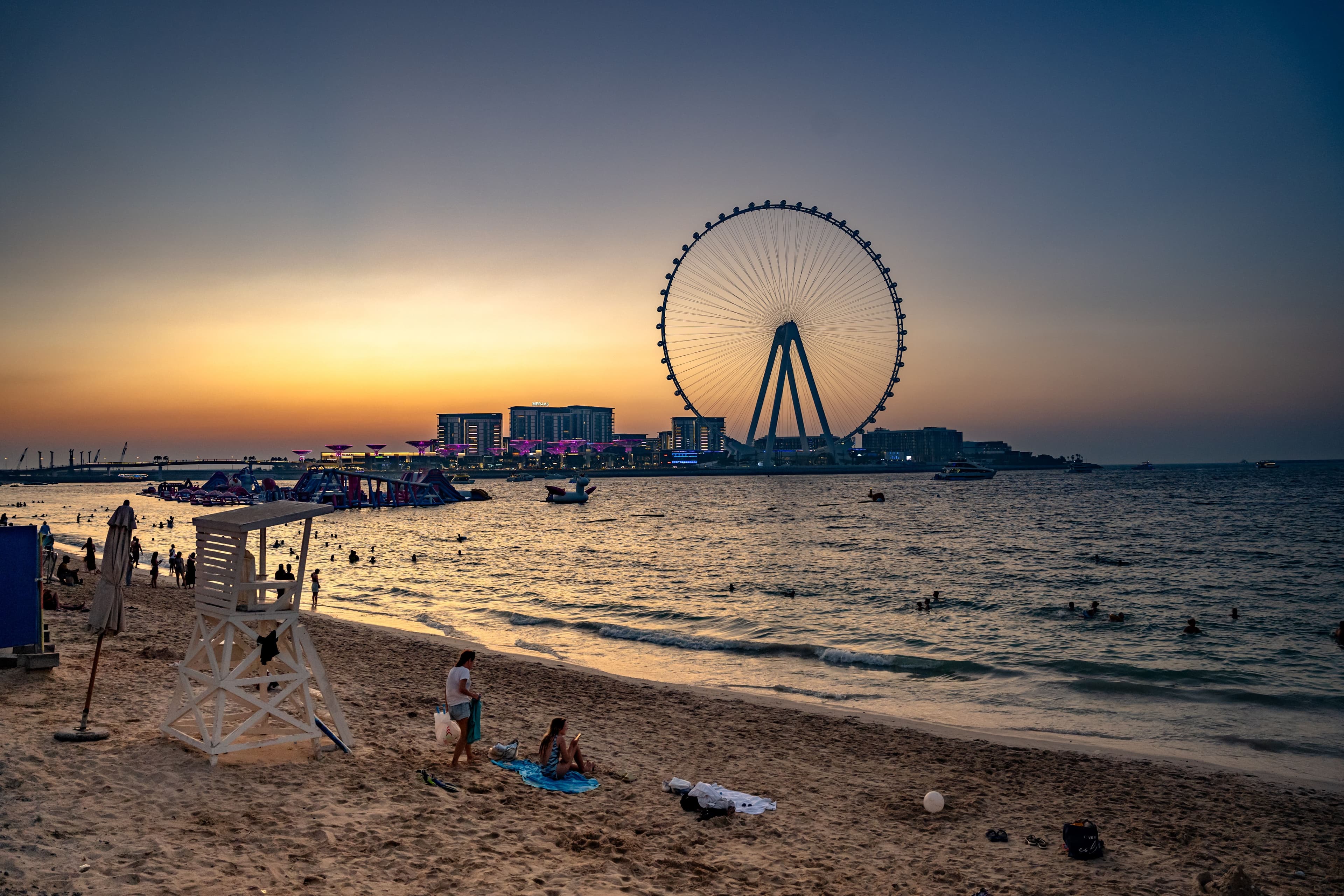Dubai Eye Ferris wheel and beach at sunset