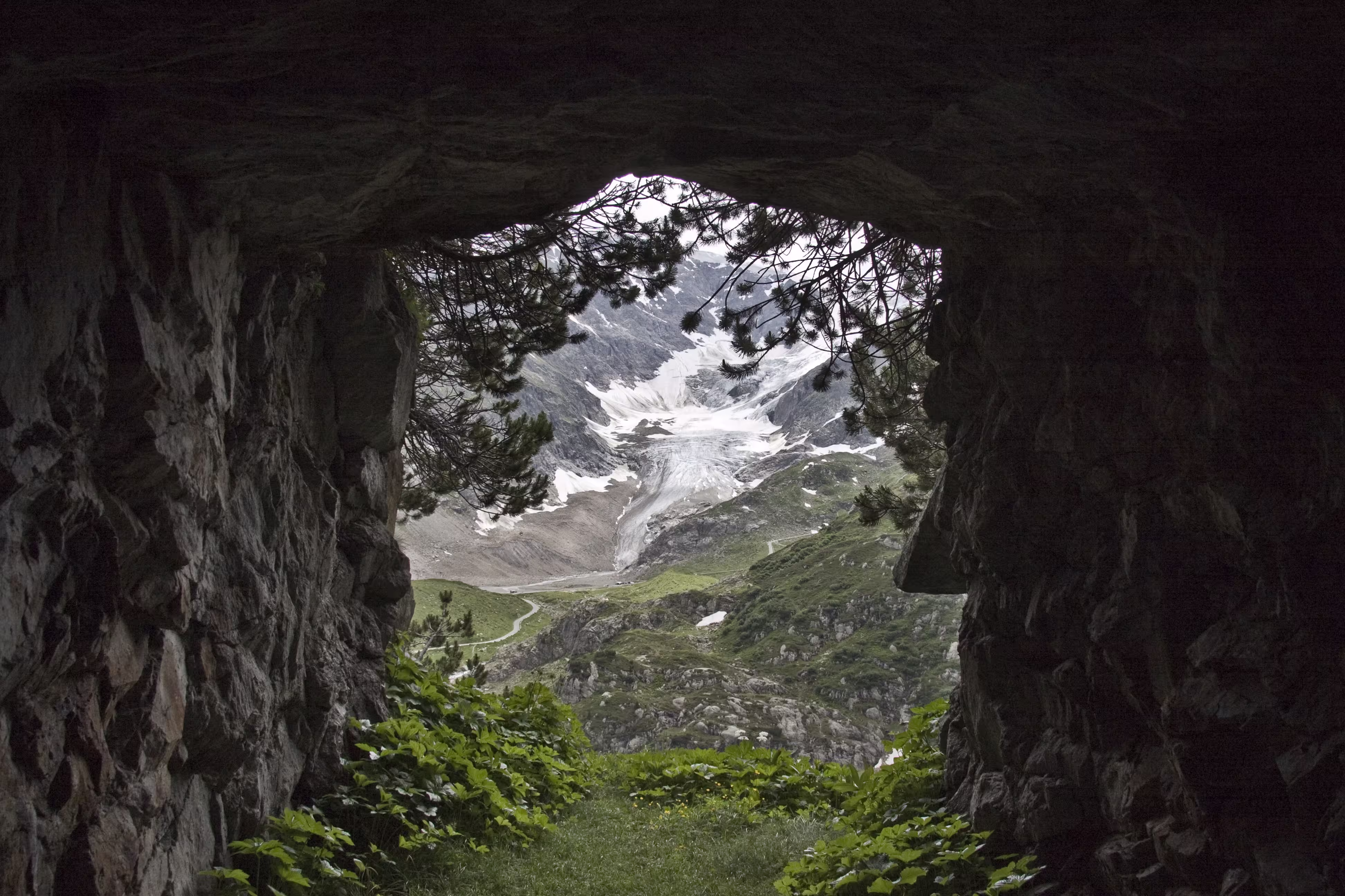 Mountain covered with snow seen from tunnel