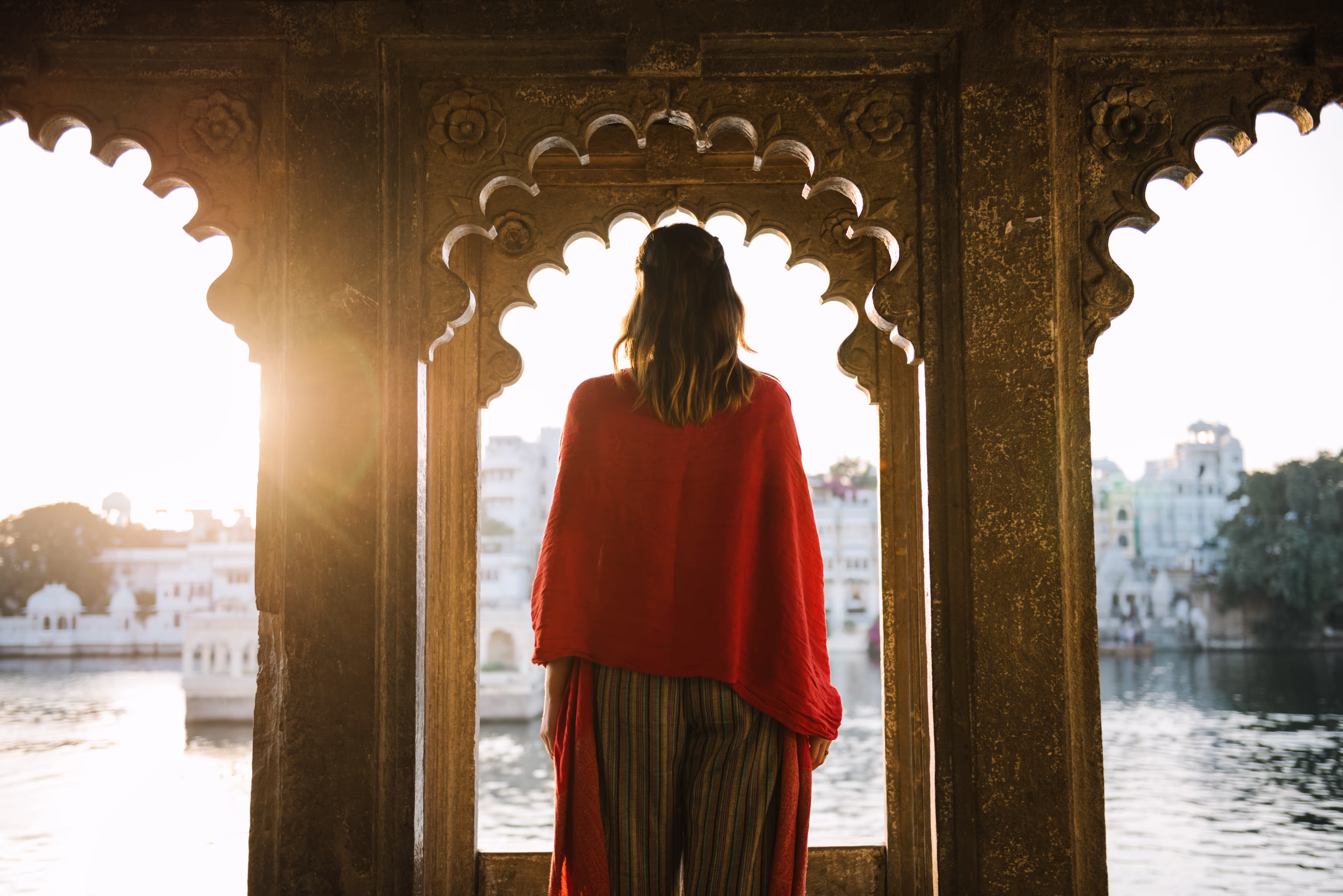 Traveller standing near traditional Indian architecture