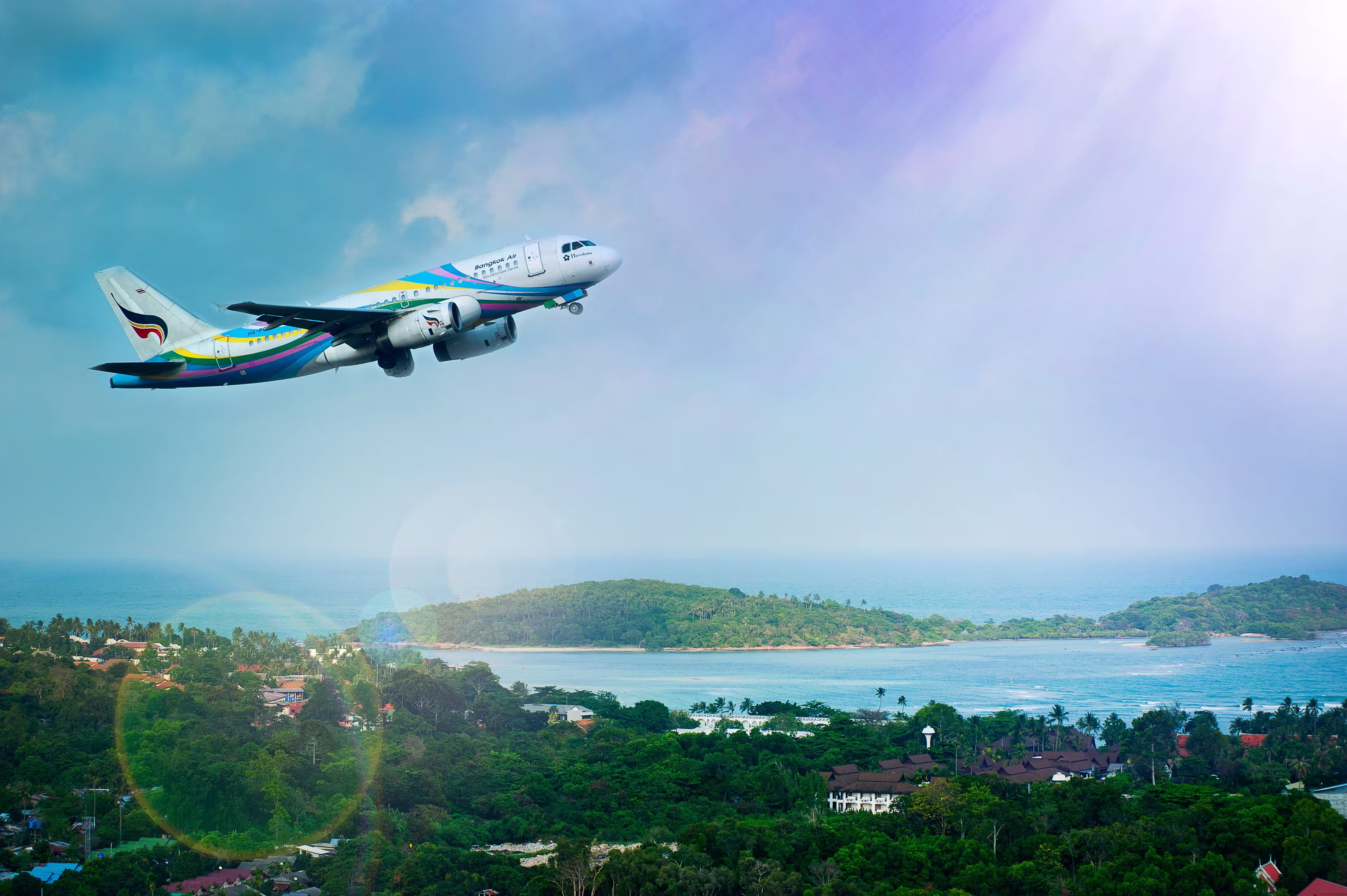 Airplane taking off at sunset