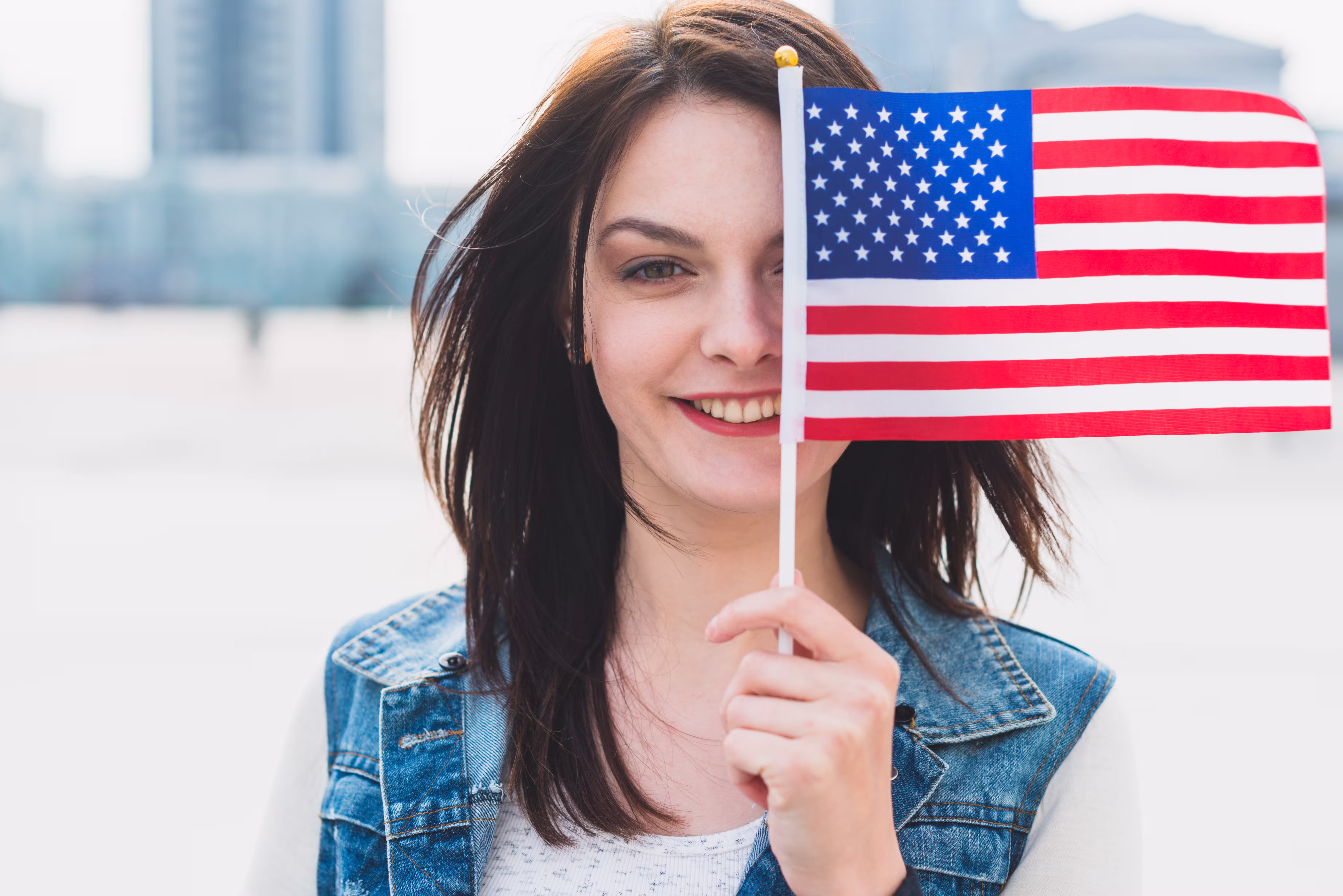 young-female-covering-face-with-american-flag