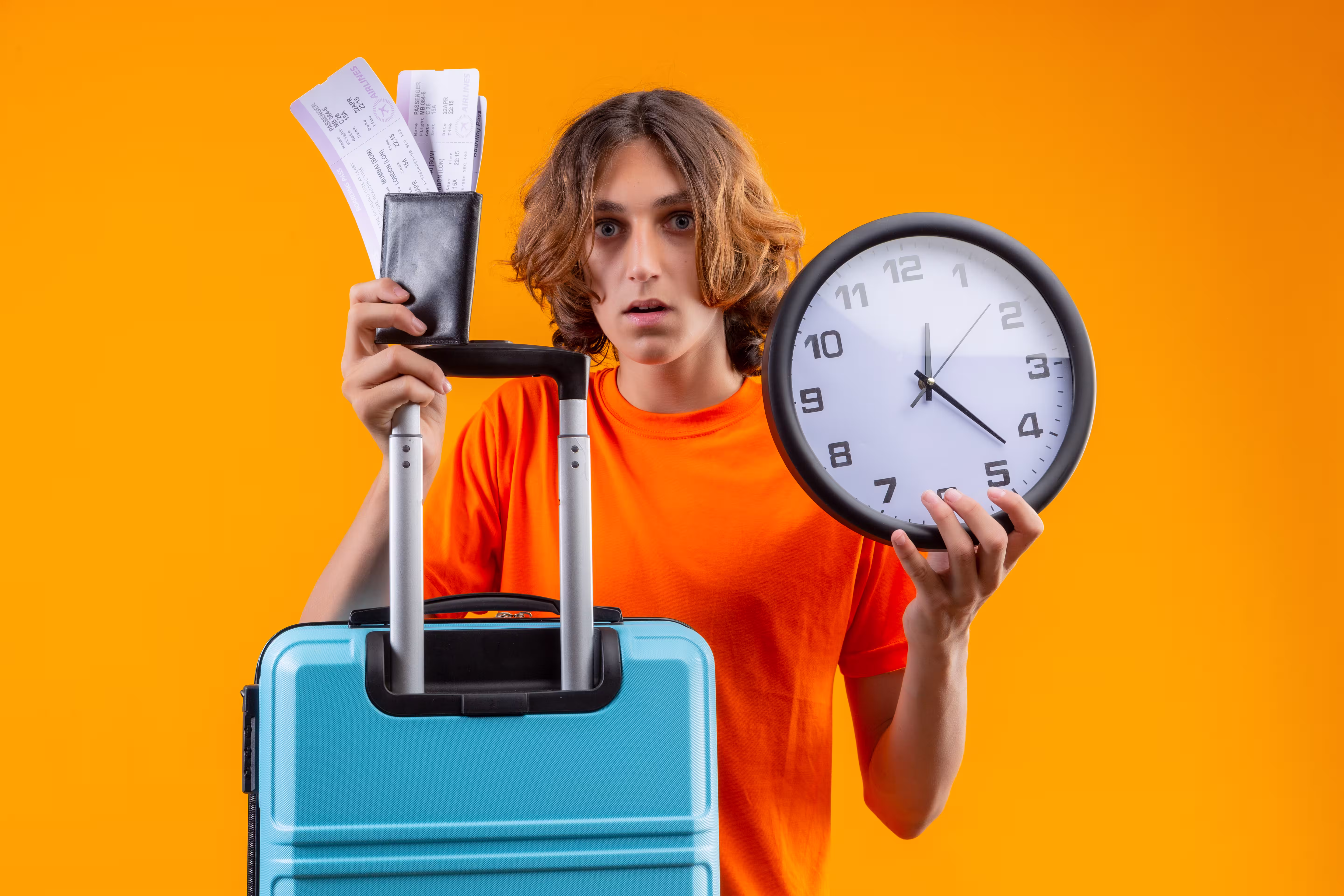 Young traveler holding a suitcase ready to book last minute fall travel